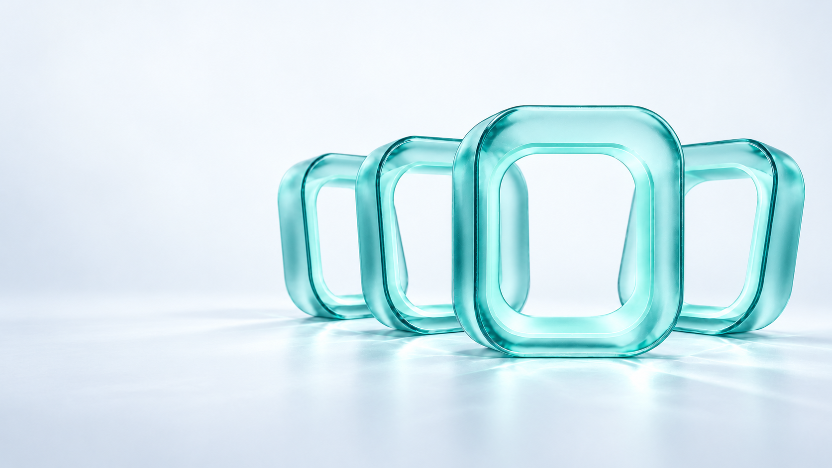Four thick translucent glass chambers, with one prepared chamber brought forward.