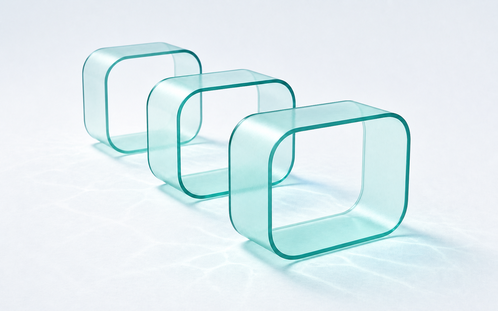 Three glass chambers receding in sequence from mint to deep teal.