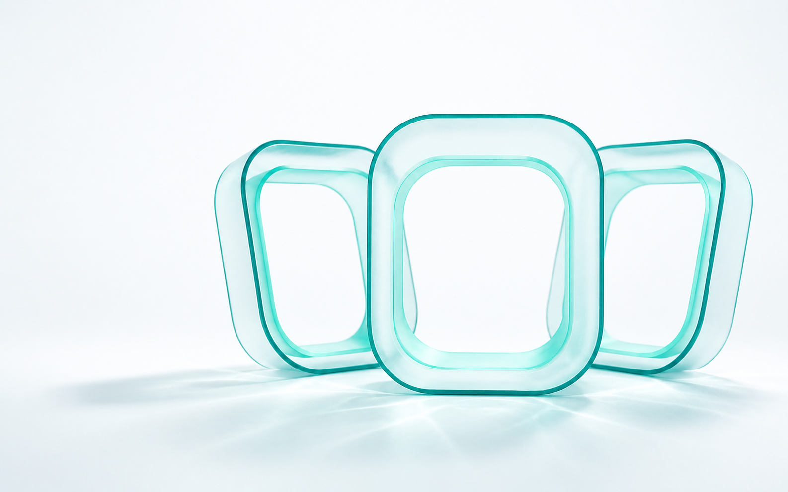 A fan of translucent teal glass chambers with a larger mint chamber in front.